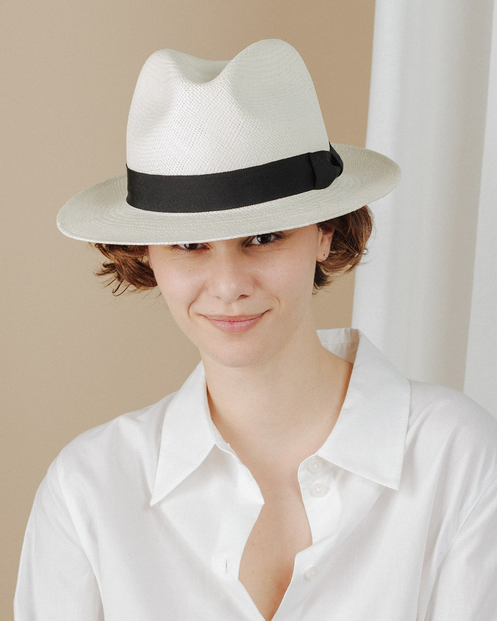 women wear cream-and-black-ribbon