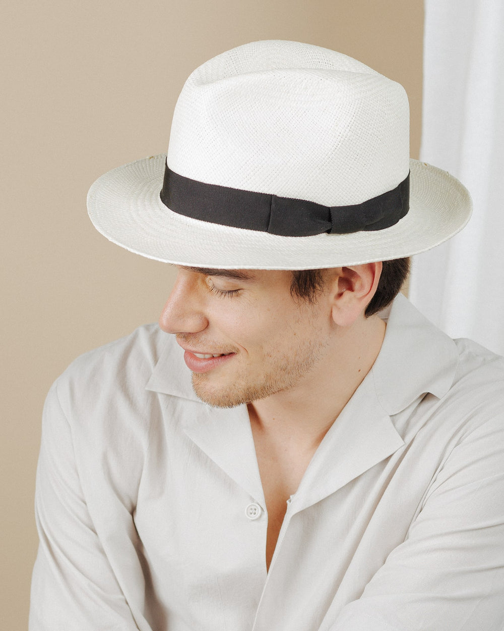 men wear cream-and-black-ribbon