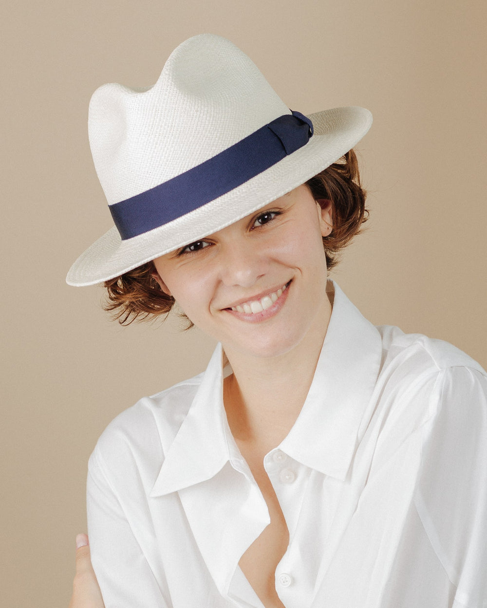 women wear cream-and-navy-ribbon