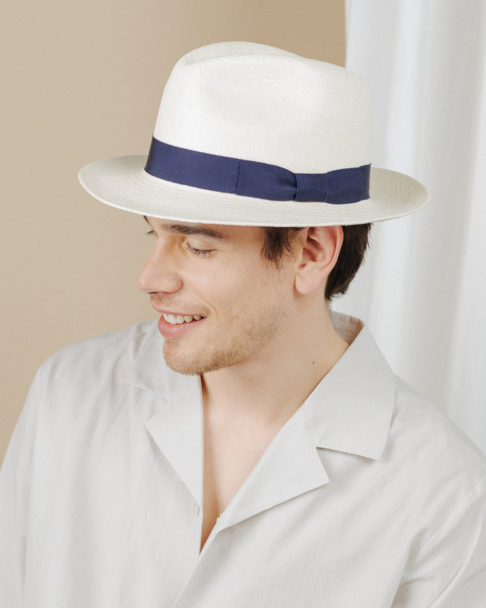 men wear cream-and-navy-ribbon