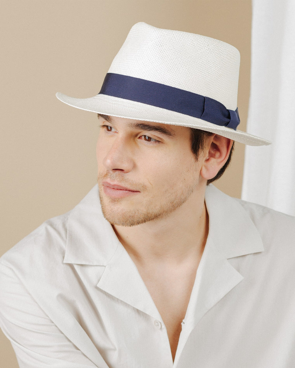 men wear cream-and-navy-ribbon